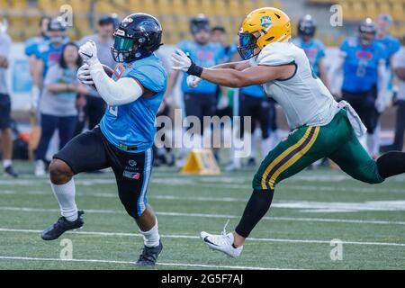 Poland. 26th June, 2021. European League of Football: Panthers Wroclaw (blue shirts) vs Leipzig Kings (white shirts) at the Olympic Stadium in Wroclaw, Poland on June 26th 2021 Pictured: Phileas Pasqualini (25) with ball Credit: Piotr Zajac/Alamy Live News Stock Photo