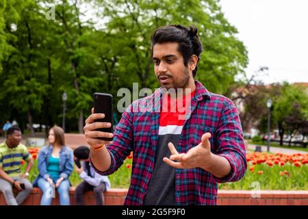 Student having online call with his family Stock Photo