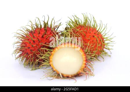 Delicious sweet fruit rambutan isolated on white background, peeled rambutan reveals white fruit pulp inside. Stock Photo