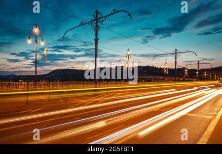 Illuminated Margaret Bridge on Danube river in Budapest Stock Photo