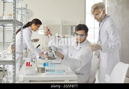 Health care student researchers working in life science or pharmacy laboratory Stock Photo