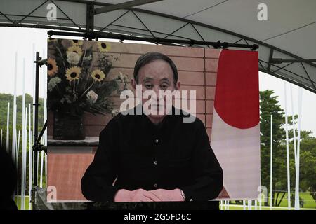June 23, 2021, Itoman, Okinawa, Japan: Video message by Prime Minister Yoshihide Suga is shown on a screen at the memorial service for the victims of the Battle of Okinawa..Okinawa marks the 76th anniversary of the end of a major World War 2 ground battle that killed over 200,000 lives including large numbers of local civilians. (Credit Image: © Jinhee Lee/SOPA Images via ZUMA Wire) Stock Photo
