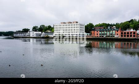 WESTPORT, CT, USA - JUNE 26, 2021: Buildings near Saugatuck river waterfront with reflections in water Stock Photo