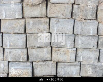 A stack of dirty gray bricks Stock Photo