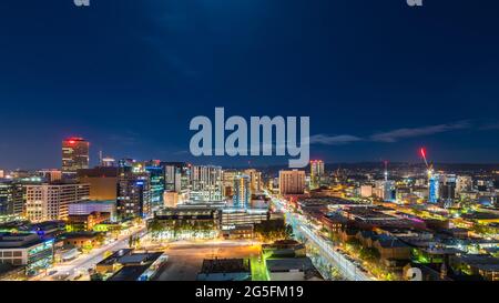 Adelaide city skyline illuminated at night viewed towards hills, South Australia Stock Photo