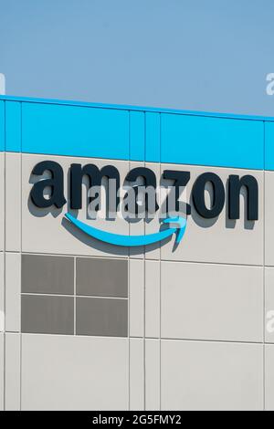 KENOSHA, WI,USA - JUNE 19, 2021 - Amazon warehouse facility exterior and trademark logo. Stock Photo