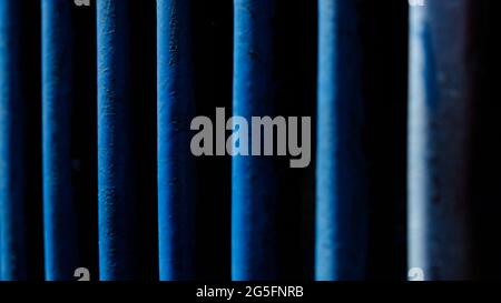 Abstract macro photography. Close up blue line pattern of steel fence Stock Photo