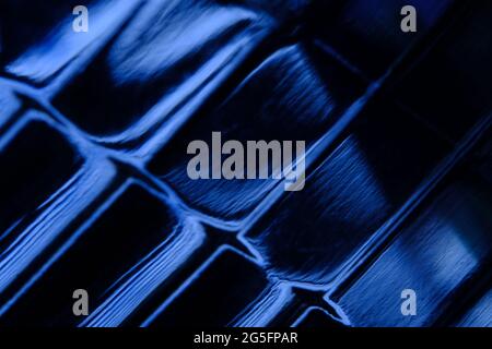 Abstract macro photography. illuminated blue light on glass lamp texture. blurred background Stock Photo