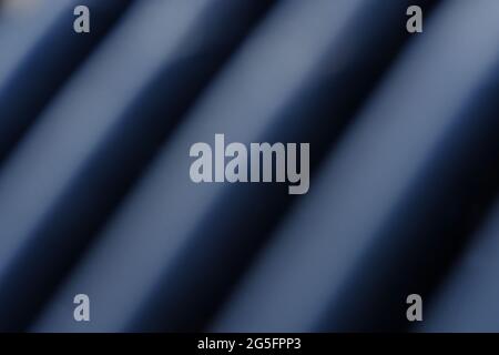 Abstract macro photography. Soft blurred metal texture, line pattern background with blue light Stock Photo