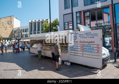 The market place from the city Friedrichshafen in Germany with different customers and boot Stock Photo