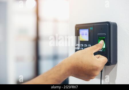 Finger print scan, Male employees press sensors to record company attendance time and after work, Time Recorder Attendance - Out work, Encryption for Stock Photo