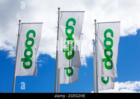 Umea, Norrland Sweden - June 7, 2021: Coop flags outside grocery store Stock Photo