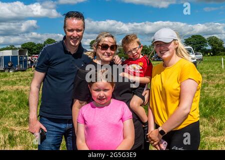 Lissangle, Caheragh, West Cork, Ireland. 27th June, 2021. There was an 8 race card at Lissangle today in the sulky racing on a very warm and sunny day. Watching the racing were John, Sinead, Abigail, Dylan and Andrea Sheehy from Baltimore. Credit: AG News/Alamy Live News Stock Photo