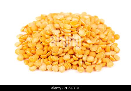 Dry yellow split peas isolated on white background. Halves of yellow legume peas. Stock Photo