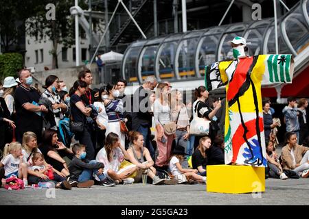 People attend the performance 'Robes-tableaux' ('Painting-dresses') by Jean-Charles de Castelbajac, at Piazza Beaubourg, in front of Centre Pompidou modern art museum, in Paris, France, June 27, 2021. REUTERS/Sarah Meyssonnier
