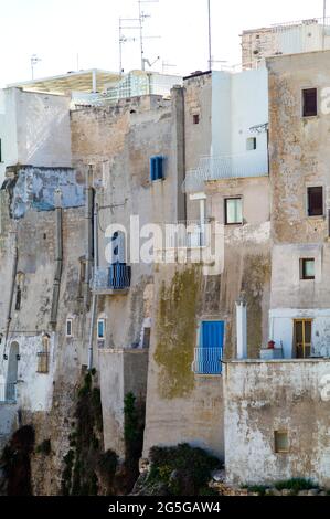 POLIGNANO A MARE, ITALY - APRIL 21 2018 : Rocky coast in Polignano. Stock Photo