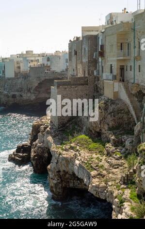 POLIGNANO A MARE, ITALY - APRIL 21 2018 : Rocky coast in Polignano. Stock Photo