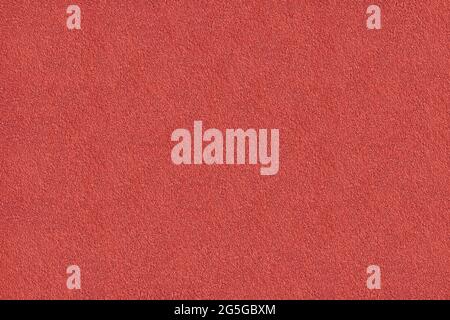 The texture of red acrylic plaster - a close-up of a freshly plastered wall Stock Photo
