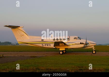 London Executive Aviation Beechcraft Super King Air 200 plane G-FRYI on a misty dawn at London Southend Airport, UK Stock Photo