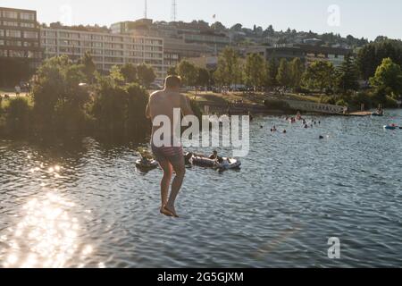 Seattle, USA. 26th Jun, 2021. Swimmers at South Lake Union during a rare heat wave. Stock Photo