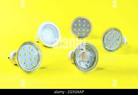 LED energy saving lamps GU10 on a yellow background. Stock Photo