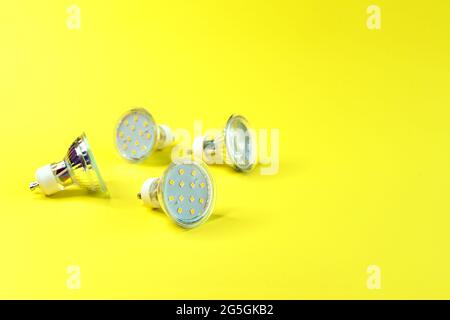 LED energy saving lamps GU10 on a yellow background. Stock Photo