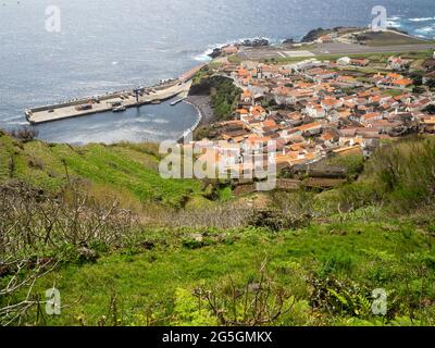 View of Vila do Corvo with the port and the airstrip, Azores Stock Photo