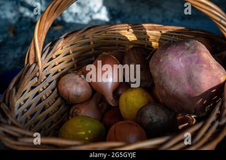 organic cultivation in a basket with lemon, onions, sweet potato Stock Photo