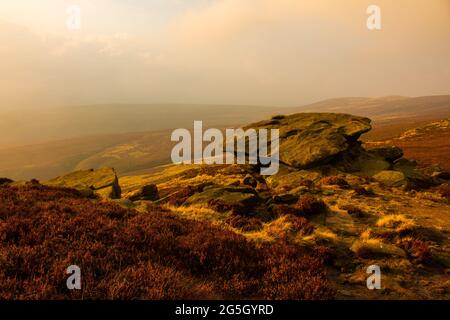 Hiking the rocky path around Ladybower Reservoir at sunset in the fog, Peak District, Derbyshire, England Stock Photo