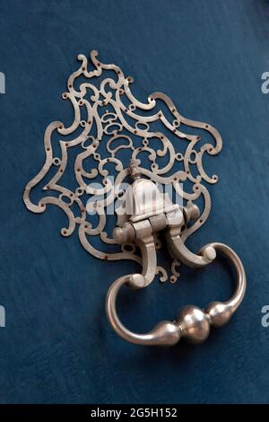 Detail of a wrought iron door knocker on a French mansion Stock Photo