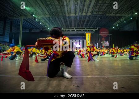 Groups of performers play and dance Okinawan typical ancient music 'Ryukyukoku Matsuri Daiko' at Tecnopolis stadium in Buenos Aires, Argentina. Stock Photo