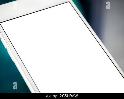 Mockup image of phone. Close-up white blank screen on mobile phone. White smartphone with empty screen. Stock Photo