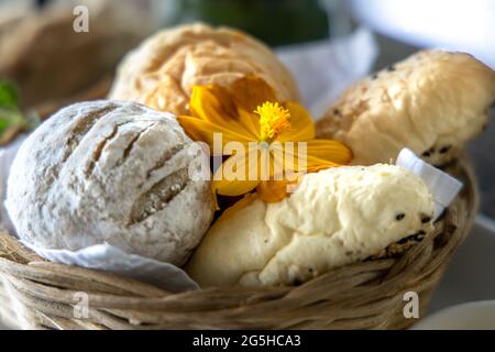 Various breads in the basket at Restaurant Stock Photo