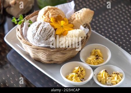 Various breads in the basket at Restaurant Stock Photo