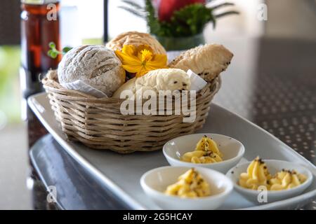 Various breads in the basket at Restaurant Stock Photo