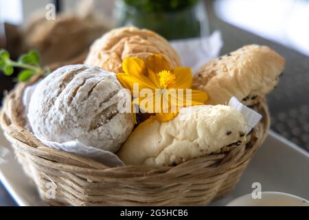 Various breads in the basket at Restaurant Stock Photo