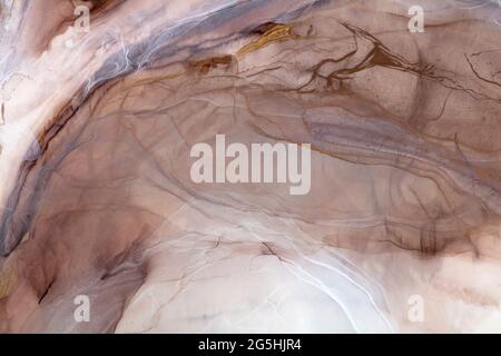 Beige painting background, new creative texture painted by alcohol ink. Stock Photo