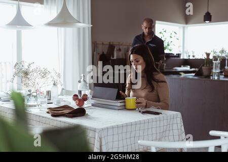 Female professional working on digital tablet at home Stock Photo