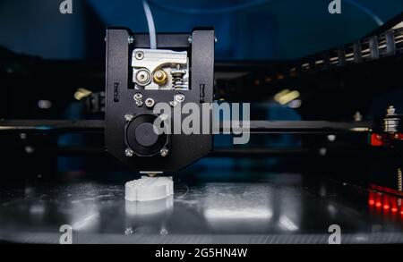 Closeup 3D Printer mechanism working element design of device during processes. Stock Photo