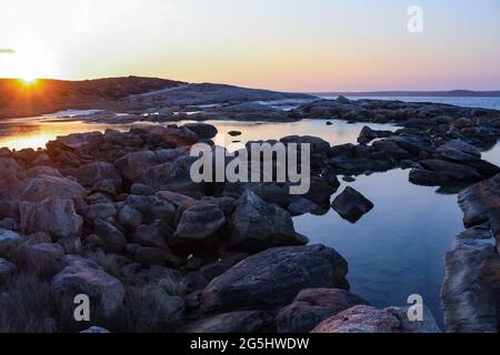 Landscape view of rockpools at sunset, taken at Two People's Bay in Western Australia's Great Southern Region. Stock Photo