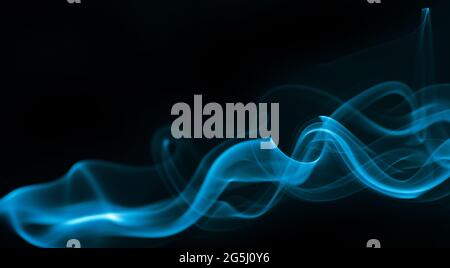 Blue smoke isolated on black background. Stock Photo