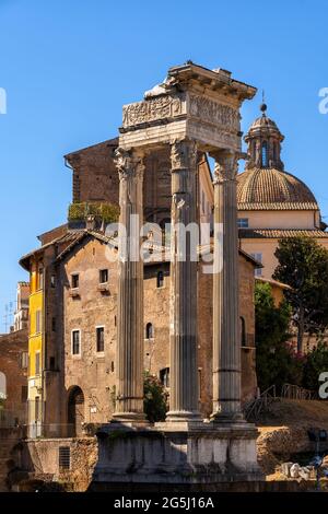 Temple of Vespasian and Titus (79 AD) ancient ruins at Roman Forum in Rome, Italy. Stock Photo