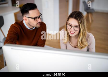 Young creative managers team working with new startup project in office Stock Photo
