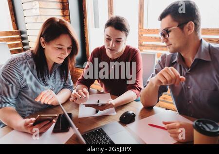 Young people brainstorm to grow the company - Meeting of millennials working together - Businessmen - Meeting of businessmen and discussing work succe Stock Photo