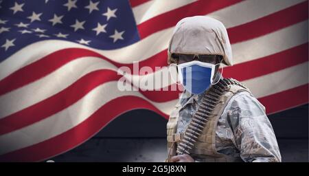 Composition of soldier wearing face mask standing to attention, against ...