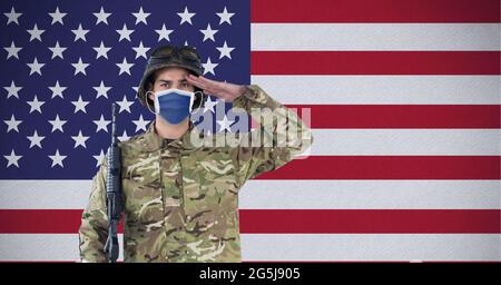 Composition of saluting male soldier wearing face mask, against ...