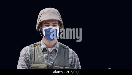 Composition of male soldier wearing face mask, standing to attention ...