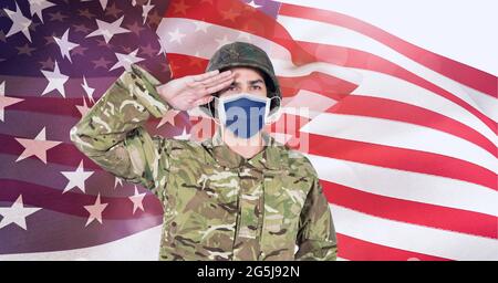 Composition of saluting male soldier wearing face mask, against ...