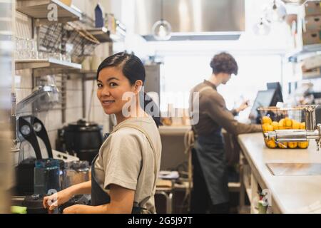 Portrait of female owner working in store Stock Photo