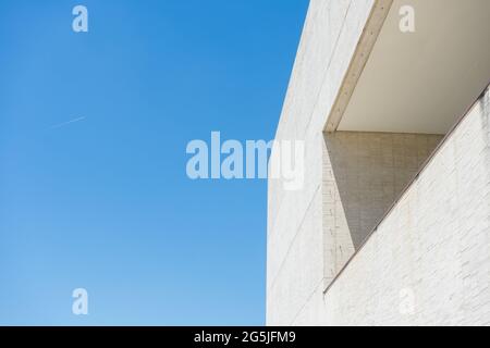 minimalist building window with straight shadow and blue sky Stock Photo